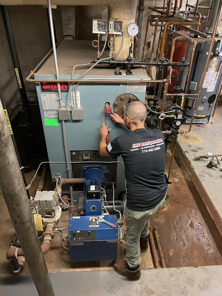 JMG Refrigeration technician servicing a commercial boiler